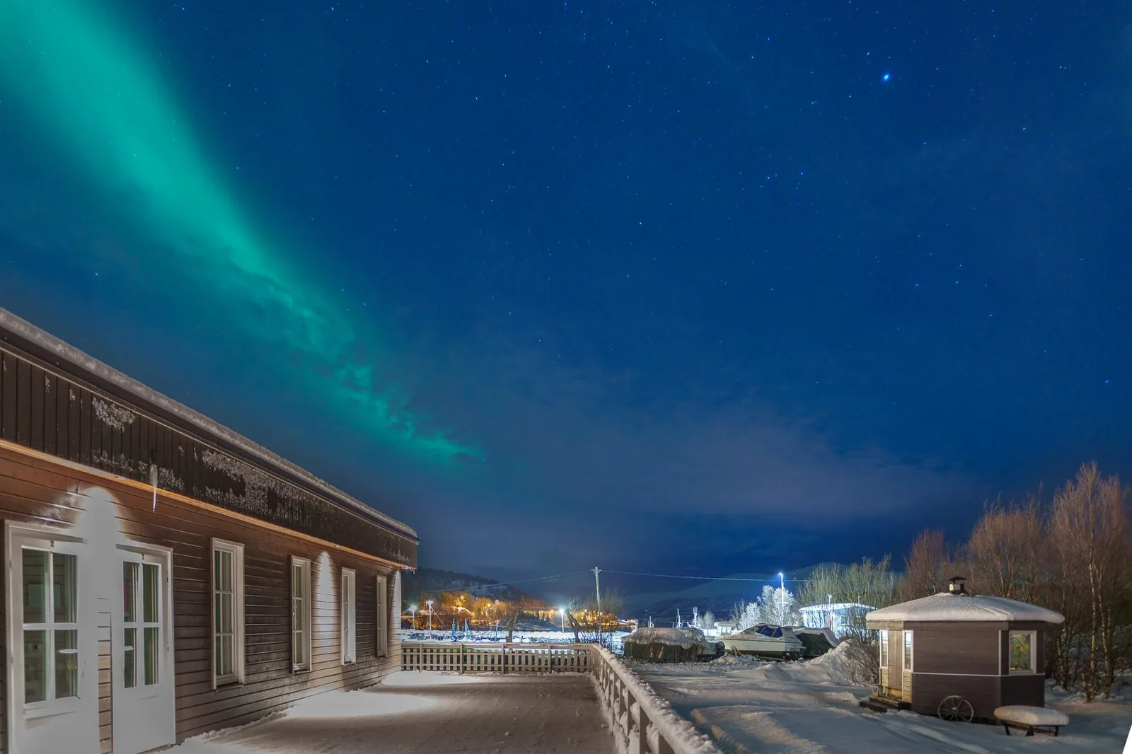 Northern Lights above the lodge at Troll Havn